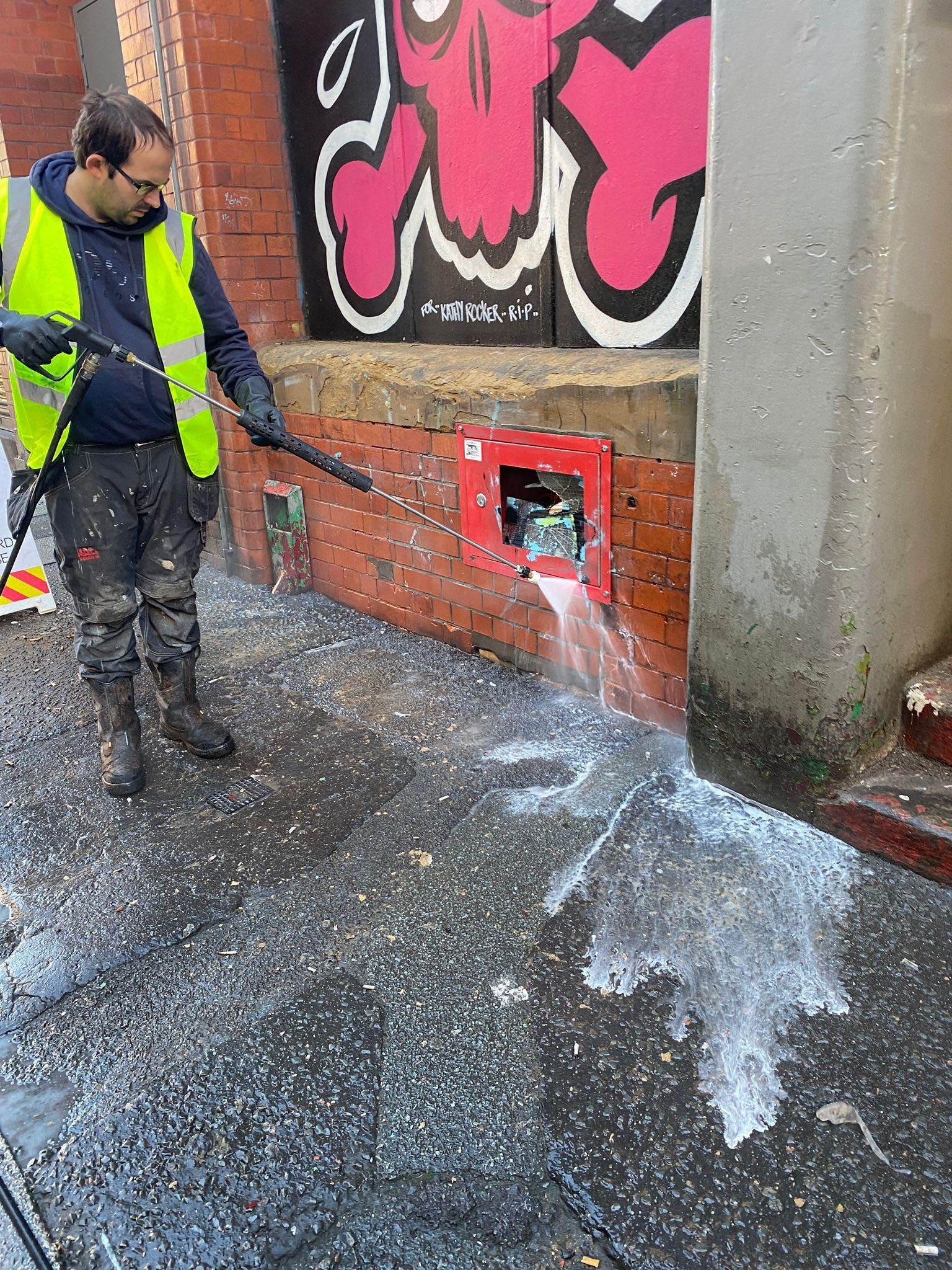 Graffiti removal from commercial brick wall