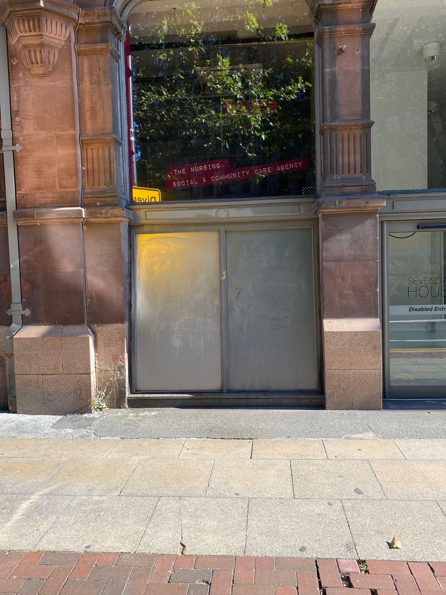 Anti-graffiti coating being applied to wall