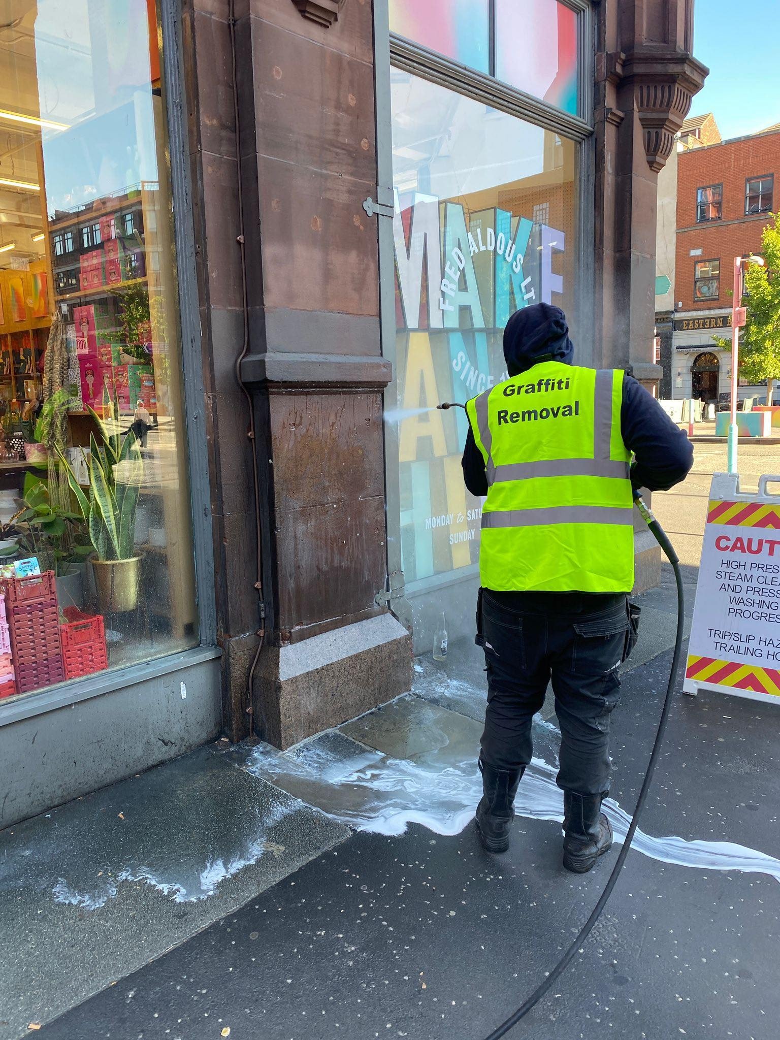 Commercial building facade being cleaned